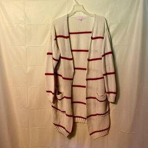 Pink Lady sweater size medium off white with rust colored stripes.